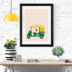 May include: A framed illustration of a green and yellow auto rickshaw, also known as a tuk-tuk, on a light peach background.