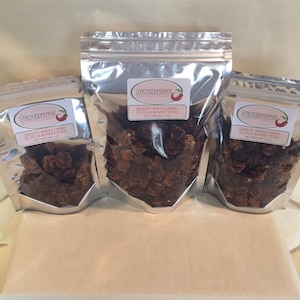 May include: Three silver bags of dried Scotch Bonnet Peppers. The bags are labeled "Strosnpepper" and "Quality Whole Dried Scotch Bonnet Peppers, Net Weight 4 oz."