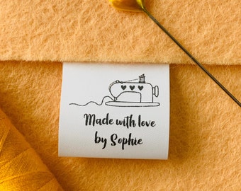 May include: White fabric label with a black sewing machine illustration and the text "Made with love by Sophie".