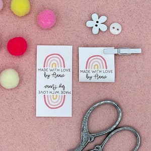 May include: Two white gift tags with a rainbow design and the text "MADE WITH LOVE by Annie".