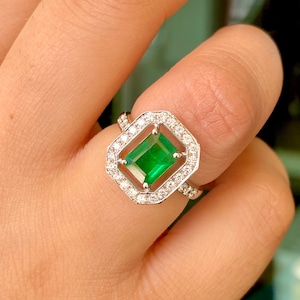 Natural 7.8X6MM Emerald ring set in 18k white gold with genuine diamonds.