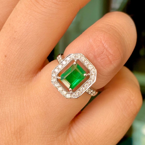 Natural 7.8X6MM Emerald ring set in 18k white gold with genuine diamonds.