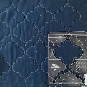 May include: A clear plastic quilting template with a design of two 8-inch interlocking quatrefoils. The template is labeled "I love to quilt..." and "www.lovetoquilt.nl".
