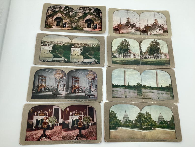 May include: A collection of vintage stereoscopic cards featuring various scenes. The cards depict buildings, monuments, and landscapes, including the U.S. Capitol, the Washington Monument, and other historical sites. The cards are in shades of brown, beige, and sepia.