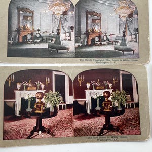 May include: Vintage stereoscopic cards depicting interior views of the White House. One card shows the "Newly Decorated Blue Room," and another, the "Red Room." The cards feature detailed images of the rooms' furnishings and decor.