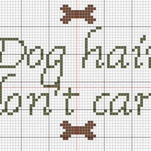 May include: Cross-stitch pattern with the text "Dog hair don't care" in green, surrounded by brown bone shapes and black paw prints.