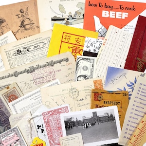May include: A collection of vintage ephemera, including receipts, postcards, playing cards, and printed materials. Notable items include a "how to buy... to cook BEEF" guide, a dollar bill, and a "Greetings" postcard. The items are arranged on a white background.