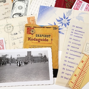 May include: A collection of vintage ephemera, including a postcard, a check, a Kodak exposure guide, and a black and white photograph of a building with people. Also included are tickets, a playing card, and a list of words.