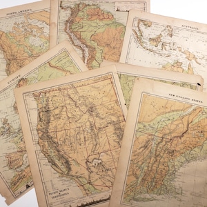 May include: A selection of antique maps, including Europe, Australia, and North America, with a sepia colour scheme. The maps display detailed geographical features. The maps are arranged on a white surface.
