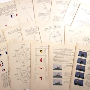 May include: A collection of vintage nautical instruction pages, featuring diagrams, illustrations, and text. The pages are aged with a cream colour, and the illustrations include flags, lights, and compass diagrams. The pages are scattered across a white surface.