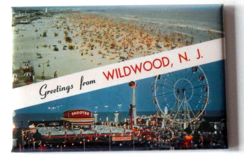May include: A vintage postcard depicting a beach scene with a crowded boardwalk and a Ferris wheel. The postcard reads "Greetings from Wildwood, N.J."