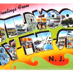 May include: A vintage postcard with the text "Greetings from Wildwood By-The-Sea N.J." in a colorful, stylized font. The postcard features images of the boardwalk, beach, and other attractions in Wildwood, New Jersey.