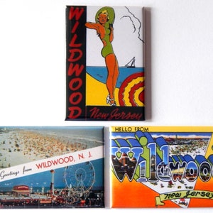 May include: Three vintage postcard magnets featuring images of Wildwood, New Jersey. The first magnet shows a woman in a swimsuit standing on a beach with the words "Wildwood, New Jersey". The second magnet shows a view of the Wildwood boardwalk with the words "Greetings from Wildwood, N.J.". The third magnet shows a stylized image of the words "Wildwood, New Jersey" with a view of the city in the background.