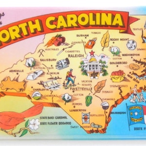 May include: A vintage postcard featuring a map of North Carolina with illustrations of various industries and agricultural products. The state bird, a cardinal, is depicted in the lower left corner. The text "Greetings from North Carolina" is displayed at the top of the postcard.