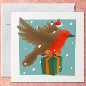 Carte de Noël Robin, Oiseau à poitrine rouge avec cadeau dans la neige sur bleu, Noël blanc traditionnel hivernal, Multi Pack de cartes-cadeaux pour ami
