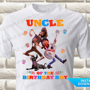 May include: White t-shirt with a colorful graphic of characters from the movie Coco. The graphic includes a skeleton playing a guitar, a dog, and the text "Uncle of the Birthday Boy".