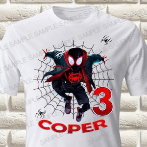 May include: White t-shirt featuring a black and red Spider-Man character in a web design. The number 3 and the name "COPER" are printed in red below the character.