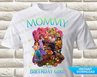 May include: White t-shirt with a colorful graphic of characters from the movie "Encanto". The text "Mommy of the Birthday Girl" is printed on the shirt.