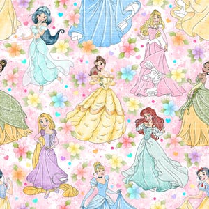 May include: A repeating pattern fabric featuring various animated princesses in colorful gowns, including yellow, blue, pink, and purple dresses, set against a light pink background decorated with small multi-colored flowers and hearts.