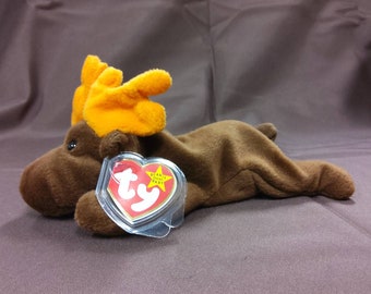 TY Beanie Baby "Chocolate" the Moose. New, never played with. Stored in a smoke free home. All tags in place. Vintage dated 1993.