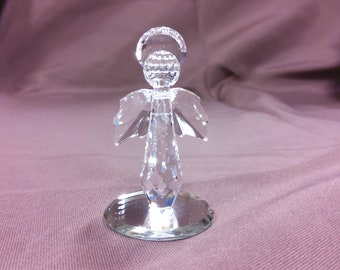 Crystal Glass Angel with the Crystals having Prismatic Affect. Sits on Round Mirror Base. Original Price Tag attached & selling at > 50% off