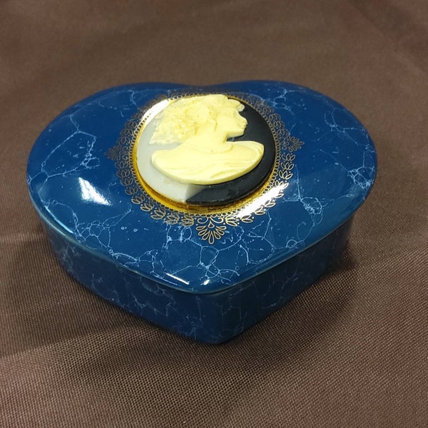 MOUNT CLEMENS POTTERY  - Blue Heart Shaped Trinket Box with an Ivory Cameo on the top. Maker's label present.