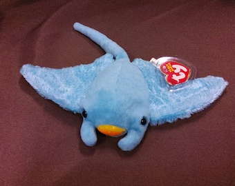 TY Beanie Baby "Sunray" the Manta Ray. New, never played with. Stored in a smoke free home. All tags in place. Dated 2002.