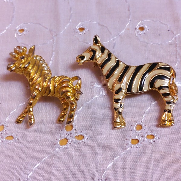 Set of Two Different ZEBRA Brooches. First is all Goldtone & the other has Black and White stripes. One is signed SAO.