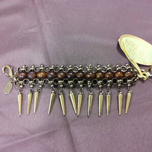 SPRING STREET Bracelet - New with original tag still attached with additional maker&#39;s mark present. Goldtone metalwork with center beads.