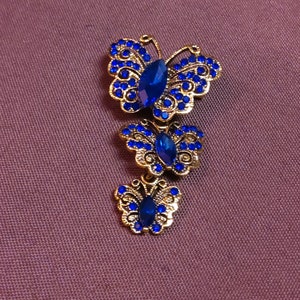 Beautiful Trio of Butterflies Brooch in Goldtone Metal Embellished with Rhinestones in shades of Blue