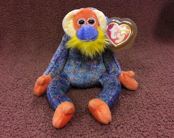 TY Beanie Baby &quot;Bananas&quot; the Orangutan. New, never played with. Stored in a smoke free home. All tags in place. Vintage dated 2000.