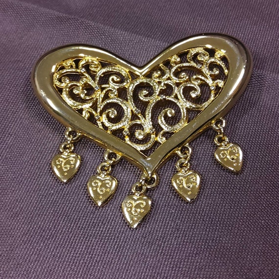 JJ Goldtone Metal Heart Shaped Brooch With a Filigree Center and 5