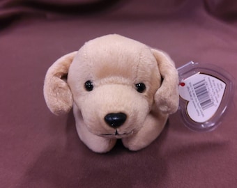 TY Beanie Baby "Fetch" the Golden Labrador. New, never played with. Stored in a smoke free home. All tags in place. Vintage dated 1998.