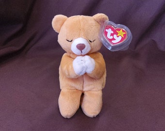 TY Beanie Baby "Hope" the Praying Bear. New, never played with. Stored in a smoke free home. All tags in place. Vintage dated 1999.
