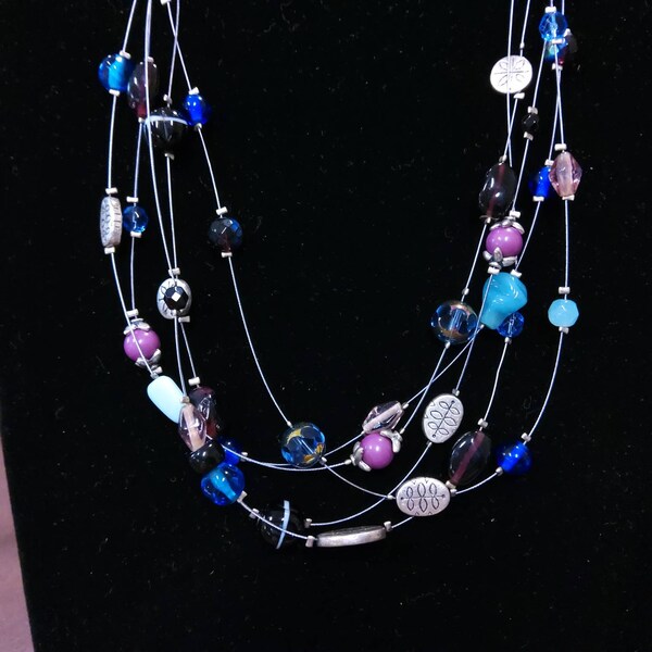 LIA SOPHIA Multistrand Wire Necklace with Multicolored Glass Beads and Spacers inBlues, Pinks and Silver. Maker's mark present.