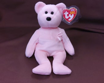 TY Beanie Baby "Cure" the Pink Breast Cancer Awareness Bear. New, never played with. Stored smoke free. All tags in place. Dated 2003