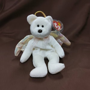 TY Beanie Baby "Halo" the Angel Bear. New, never played with. Stored in a smoke free home. All tags in place. Vintage dated 1998.