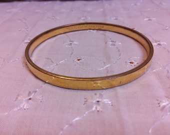 KATE SPADE "Heart of Gold" Goldtone Bangle Bracelet. Maker's mark present.