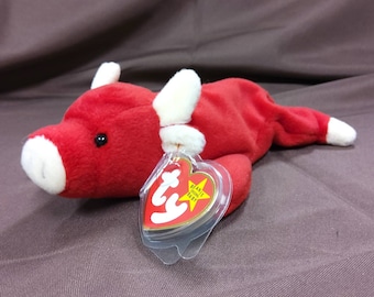 TY Beanie Baby "Snort" the Red Bull. New, never played with. Stored in a smoke free home. All tags in place. Vintage dated 1995.