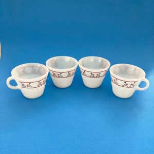 Set of 4 vintage termocrisa cups/mugs in excellent used condition. Red and green flower pattern.