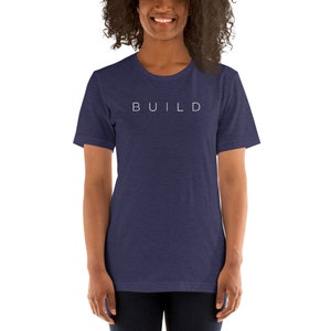 May include: A navy blue t-shirt with the word "BUILD" printed in white on the front.