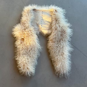 white fur vest