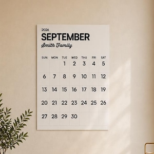 May include: A wall-mounted calendar for September 2026 featuring the text Smith Family in black ink on a white background. The calendar displays a standard grid layout with days of the week and dates from 1 to 30 in a clean, sans-serif font.