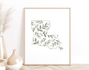 May include: A framed print of the state of Louisiana with a green and white floral pattern.