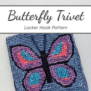 May include: A blue and purple butterfly trivet with a black outline. The trivet is made with a locker hook pattern. The trivet is on a white background.