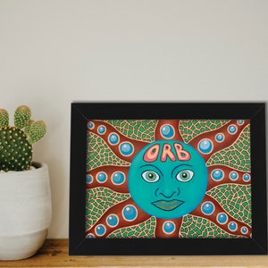 May include: Framed artwork featuring a green and blue orb with a face and the word "ORB" written across the forehead. The orb is surrounded by brown and green swirls and blue circles.