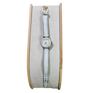 Vintage Swiss Made Hanowa montre-bracelet en cuir blanc doré décoloré terni