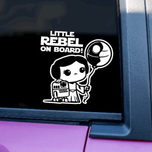 Naklejka Little Rebel On Board | Naklejka na pojazd | Inspirowane Gwiezdnymi Wojnami | Baby On Board | Księżniczka Leia | Mandalorian | Naklejka na samochód | Rebel Jedi
