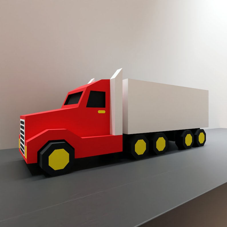 May include: A red toy semi-truck with a white trailer. The truck has yellow wheels and a black windshield. The trailer has black wheels.