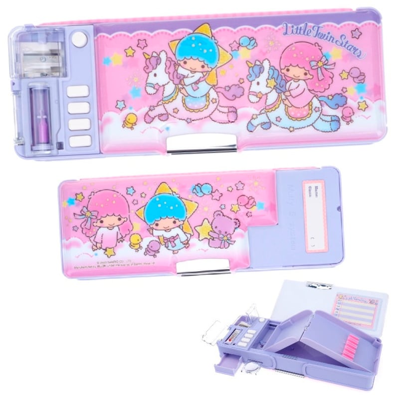 May include: A pink and purple pencil case with a Little Twin Stars design. The case has a built-in sharpener and a compartment for pencils and other supplies. The case is open to reveal the interior compartments.